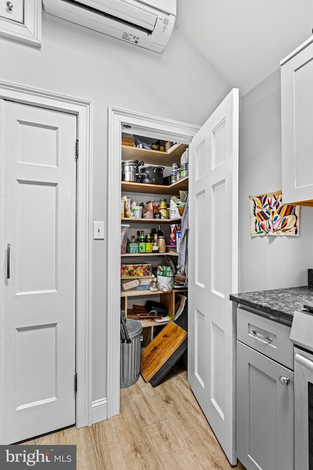 pantry with an AC wall unit