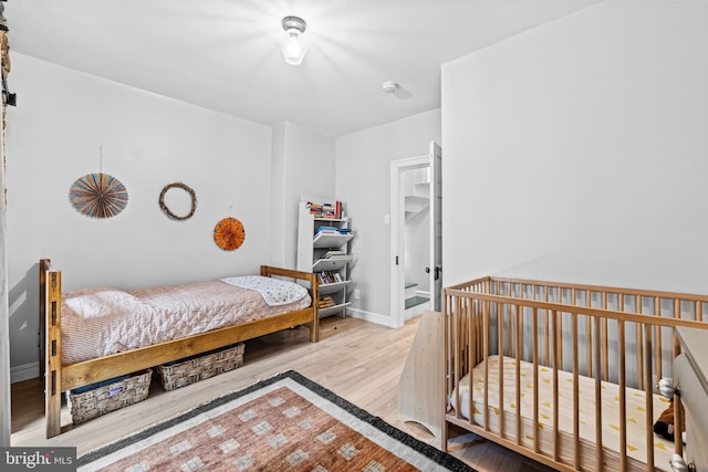bedroom featuring wood finished floors