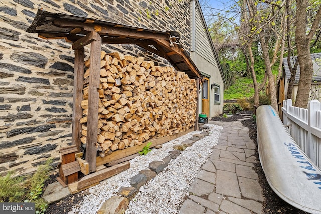 view of home's exterior with fence