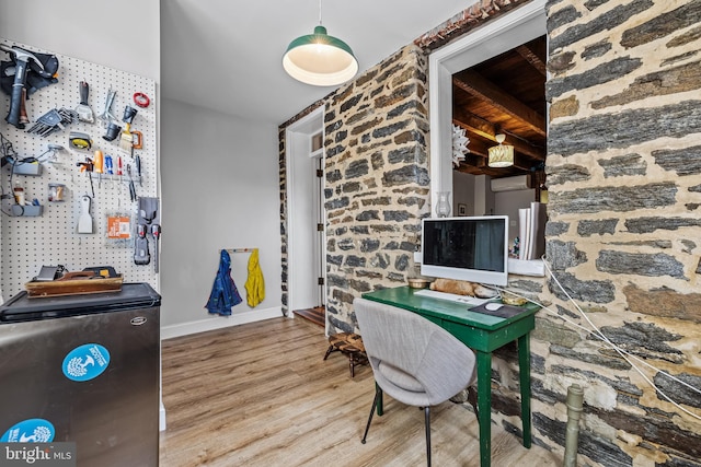 office with wood finished floors and baseboards