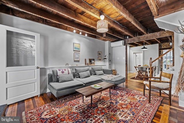 living area featuring wooden ceiling, beam ceiling, and a wall unit AC