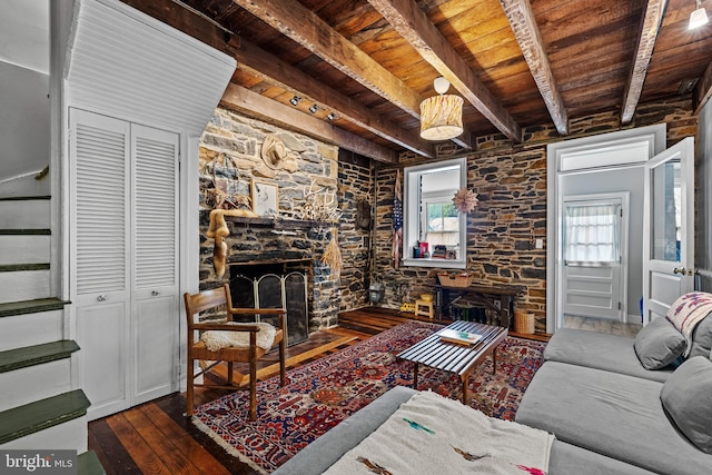 living room featuring beamed ceiling, wooden ceiling, stairway, and hardwood / wood-style flooring