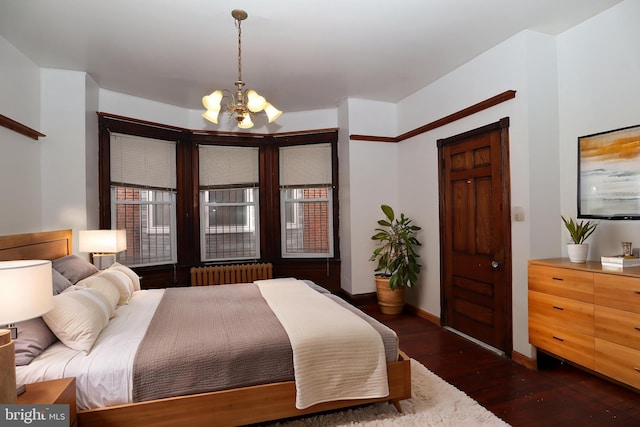 4505 Chester Ave, Philadelphia, PA 19143 - bedroom with radiator heating unit, a chandelier, wood finished floors, and baseboards