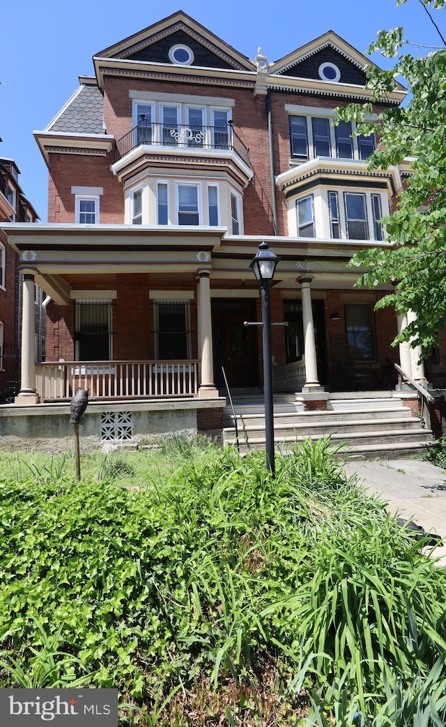 4505 Chester Ave, Philadelphia, PA 19143 - victorian house with brick siding and covered porch