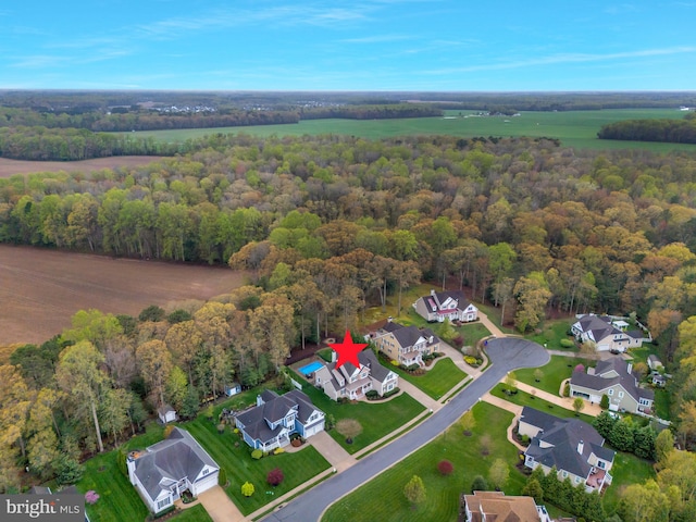 aerial view with a forest view and a residential view