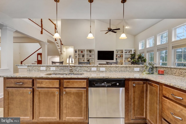 kitchen with high vaulted ceiling, light stone counters, a ceiling fan, stainless steel dishwasher, and a sink