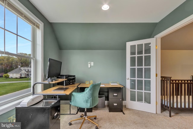 office with carpet flooring and vaulted ceiling