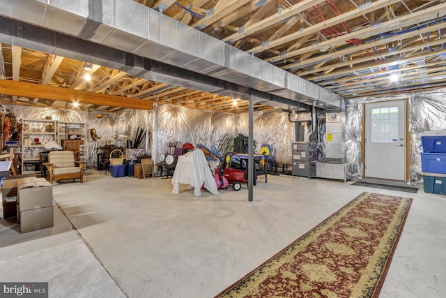 below grade area featuring heating unit
