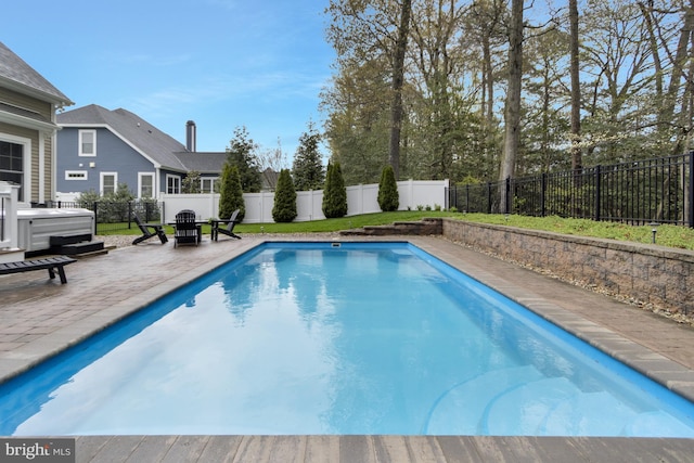 view of pool featuring a patio area, a fenced backyard, and a fenced in pool