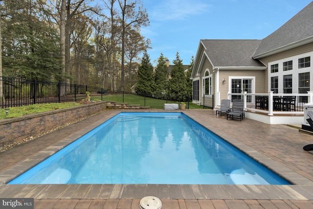 view of pool featuring a fenced in pool, a patio, and a fenced backyard