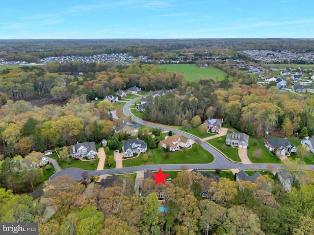 aerial view with a residential view and a view of trees
