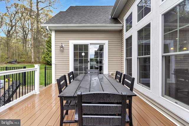 wooden terrace with outdoor dining area