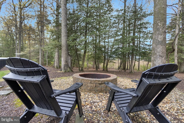 view of yard with a fire pit