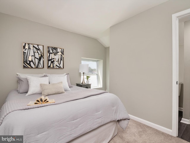 bedroom featuring baseboards and carpet