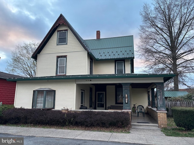 133 Black St, Howard, PA 16841 - exterior space featuring a porch, a chimney, and metal roof