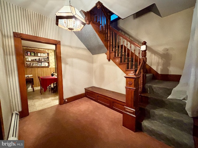 133 Black St, Howard, PA 16841 - stairway featuring a baseboard radiator, baseboards, wallpapered walls, and carpet