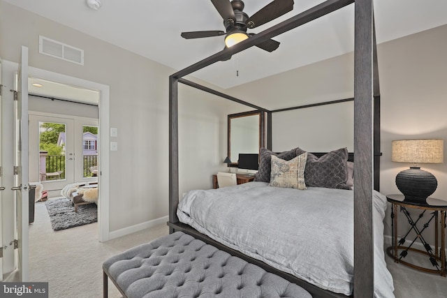 carpeted bedroom featuring a ceiling fan, visible vents, french doors, and baseboards