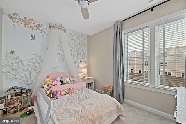 carpeted bedroom featuring a ceiling fan and baseboards