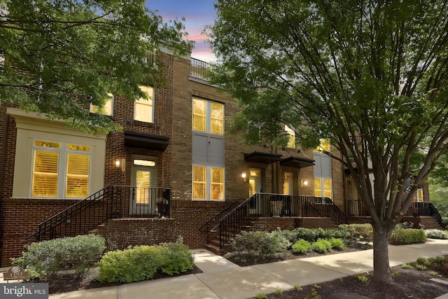 view of front of property featuring brick siding