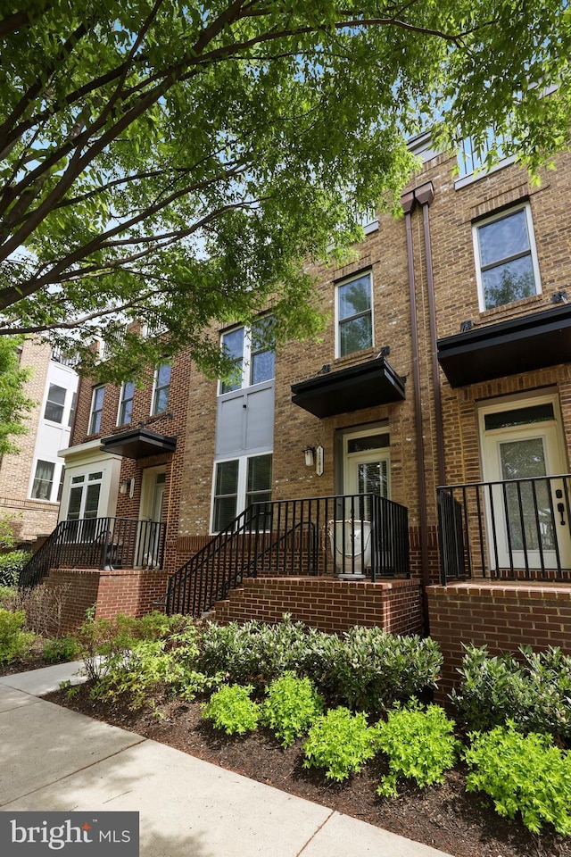 view of front of home with brick siding