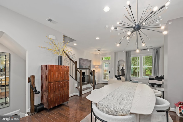 dining room with stairway, a chandelier, dark wood-style flooring, baseboards, and visible vents