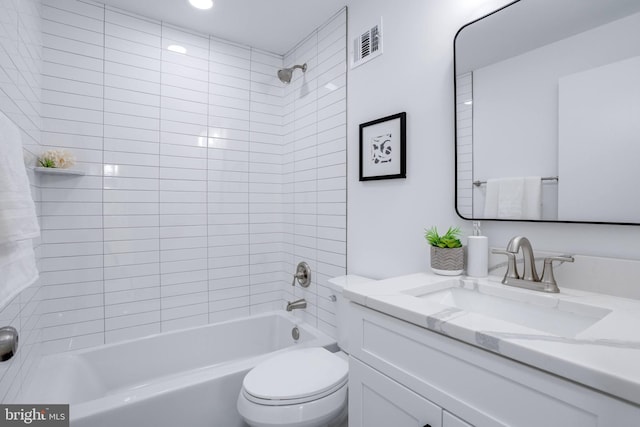 full bath with shower / bathtub combination, visible vents, toilet, and vanity