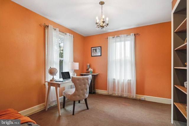 office space with carpet floors, baseboards, and a chandelier