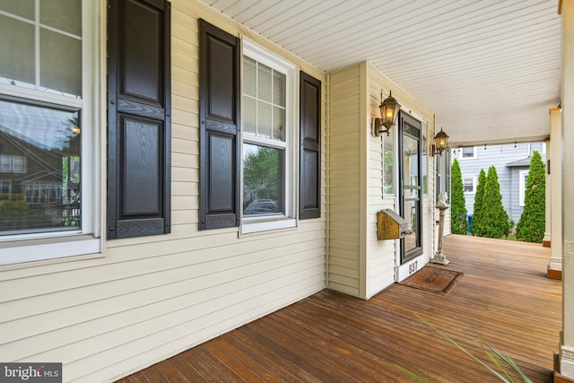 wooden terrace with a porch
