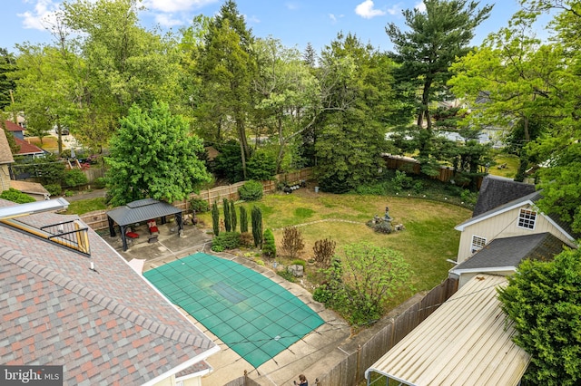 exterior space featuring a fenced in pool, a fenced backyard, a gazebo, and a patio