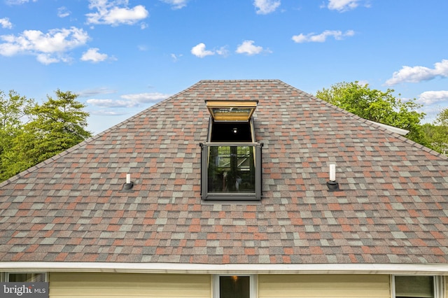 exterior details featuring a shingled roof