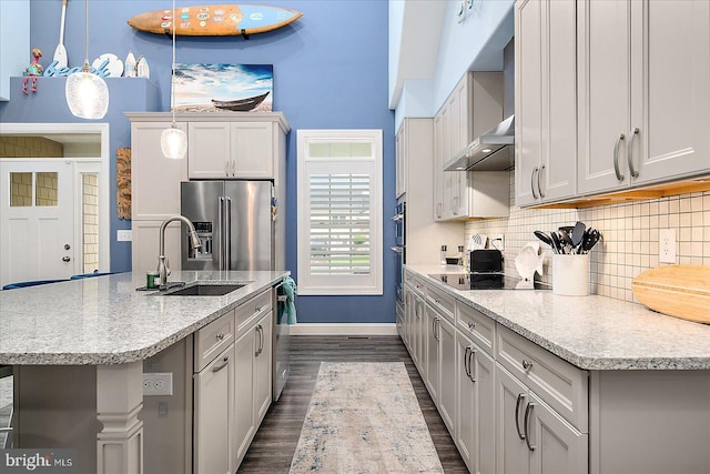 14626 Blue Heron Dr, Ocean View, DE 19970 - kitchen with a sink, appliances with stainless steel finishes, baseboards, tasteful backsplash, and dark wood-style floors