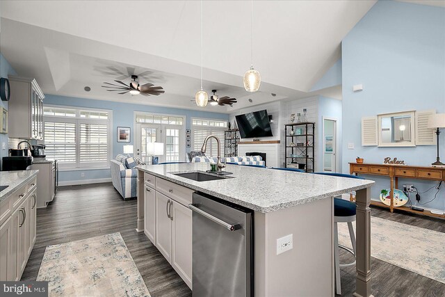 14626 Blue Heron Dr, Ocean View, DE 19970 - kitchen with stainless steel dishwasher, a sink, ceiling fan, dark wood-type flooring, and open floor plan