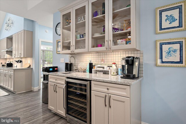 14626 Blue Heron Dr, Ocean View, DE 19970 - bar area with wine cooler, tasteful backsplash, dark wood finished floors, a sink, and baseboards