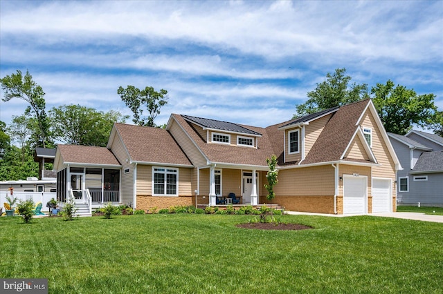 14626 Blue Heron Dr, Ocean View, DE 19970 - view of front facade with a sunroom, a front lawn, concrete driveway, and a porch