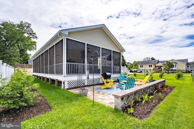 14626 Blue Heron Dr, Ocean View, DE 19970 - rear view of house with a patio area and a sunroom