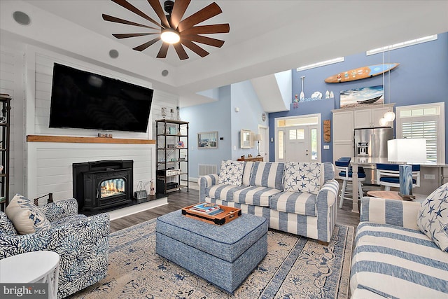 14626 Blue Heron Dr, Ocean View, DE 19970 - living area featuring wood finished floors, a large fireplace, and a ceiling fan