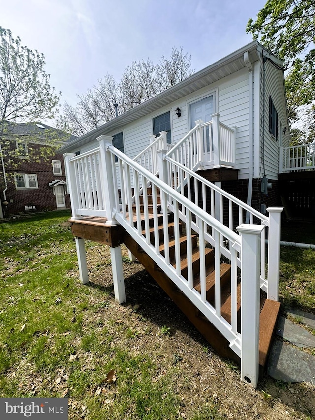 back of house featuring a deck