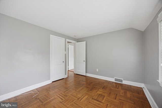 510 W S Ave, Glenolden, PA 19036 - empty room with visible vents, baseboards, and vaulted ceiling
