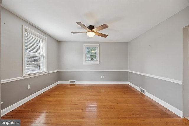 510 W S Ave, Glenolden, PA 19036 - empty room with light wood finished floors, baseboards, a ceiling fan, and visible vents
