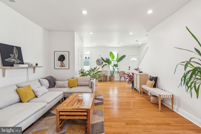 living room featuring recessed lighting and light wood finished floors
