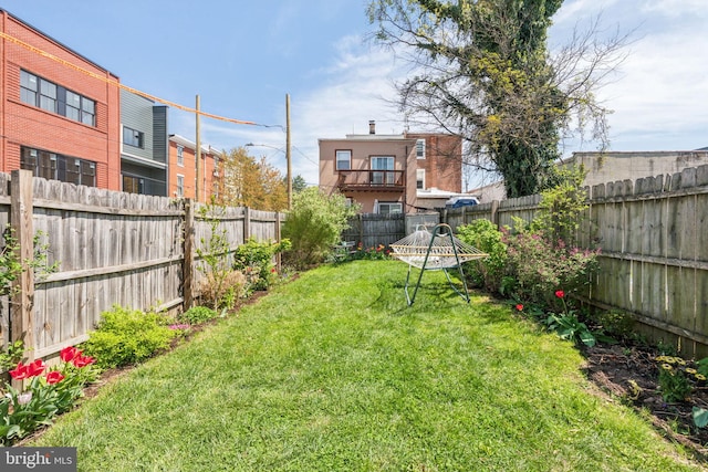 view of yard with a fenced backyard