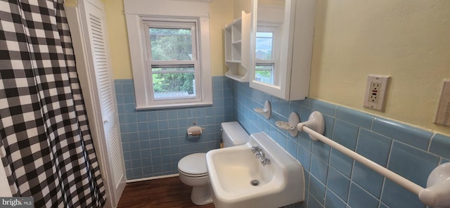 209 N Pine St, Seaford, DE 19973 - full bathroom with toilet, tile walls, a wainscoted wall, healthy amount of natural light, and wood finished floors