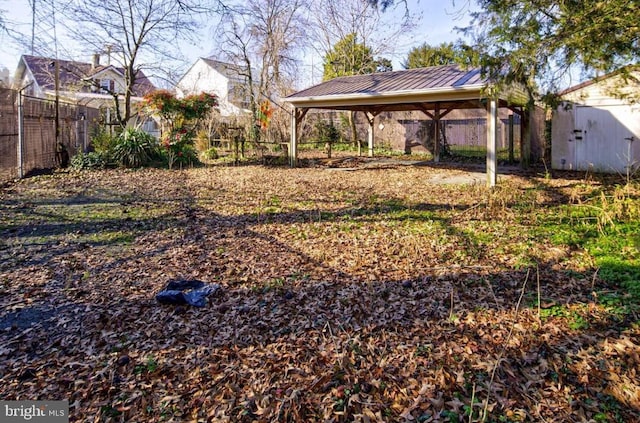 209 N Pine St, Seaford, DE 19973 - fenced backyard featuring a gazebo and a carport