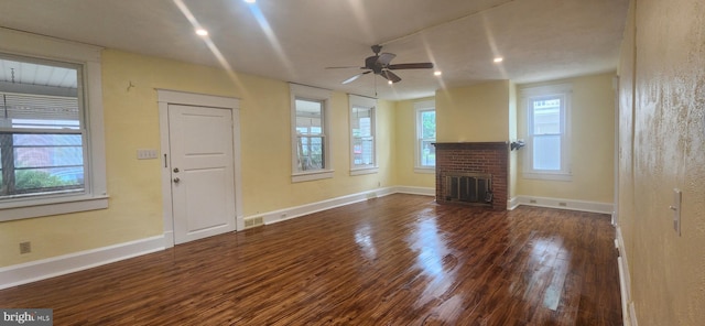 209 N Pine St, Seaford, DE 19973 - unfurnished living room with wood finished floors, a ceiling fan, baseboards, a brick fireplace, and recessed lighting