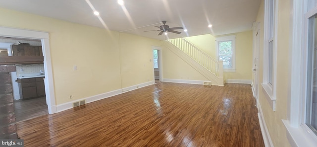 209 N Pine St, Seaford, DE 19973 - unfurnished living room with ceiling fan, wood finished floors, stairs, and baseboards