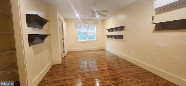209 N Pine St, Seaford, DE 19973 - spare room featuring an AC wall unit, a ceiling fan, wood finished floors, and baseboards