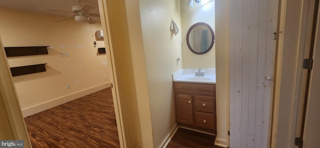 209 N Pine St, Seaford, DE 19973 - bathroom featuring wood finished floors, vanity, ceiling fan, and baseboards