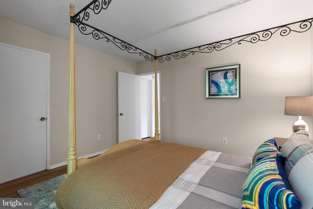 bedroom featuring wood finished floors