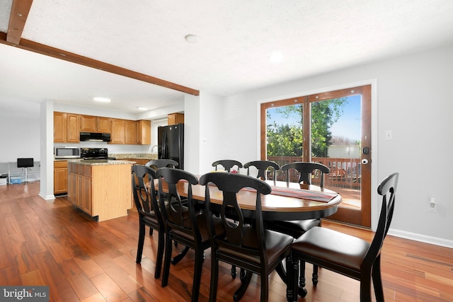 dining room with recessed lighting, baseboards, and dark wood-style floors
