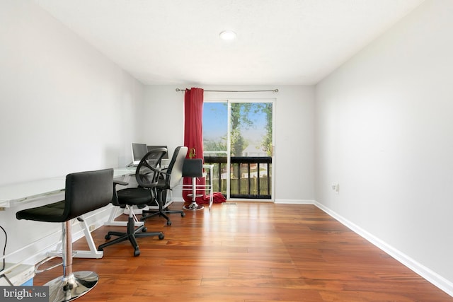 home office featuring baseboards, recessed lighting, and wood finished floors